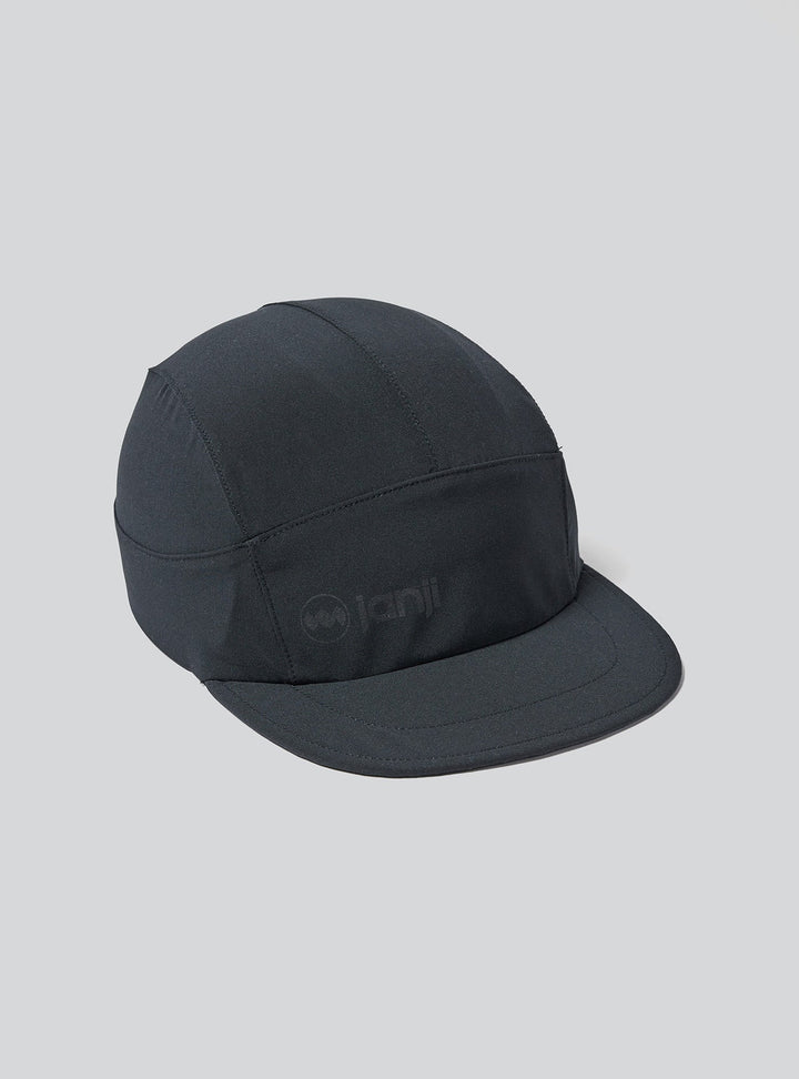 Angled front view of Janji AFO Hyperlight cap showing low-profile brim