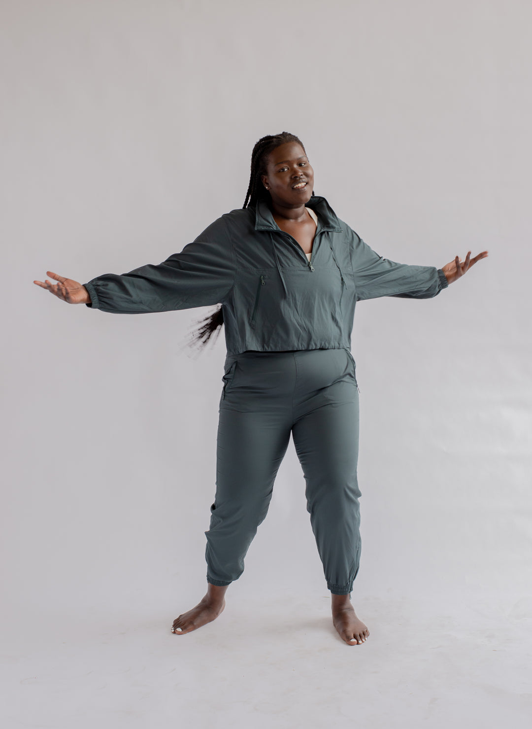 Model  in Summit Track Pants – Moss, showing tapered fit