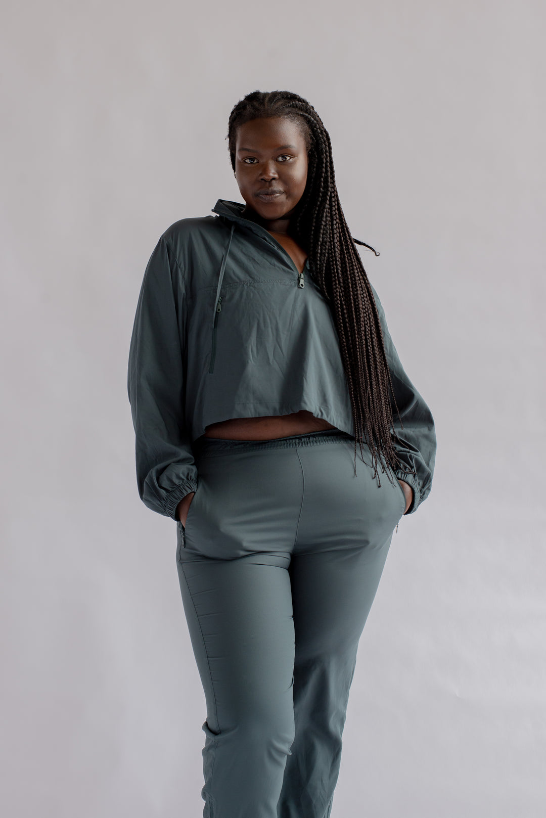 Close up of Girlfriend Collective Summit Track Pants in Moss with side pocket detail