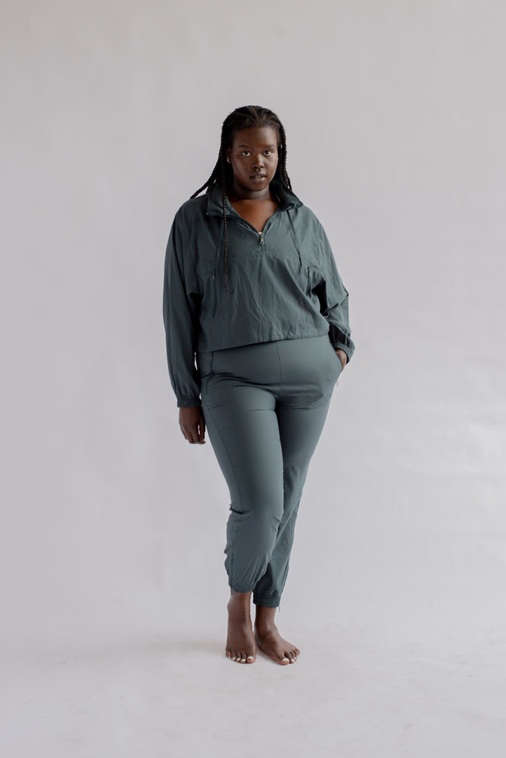 Front view of Girlfriend Collective Summit Track Pants in Moss