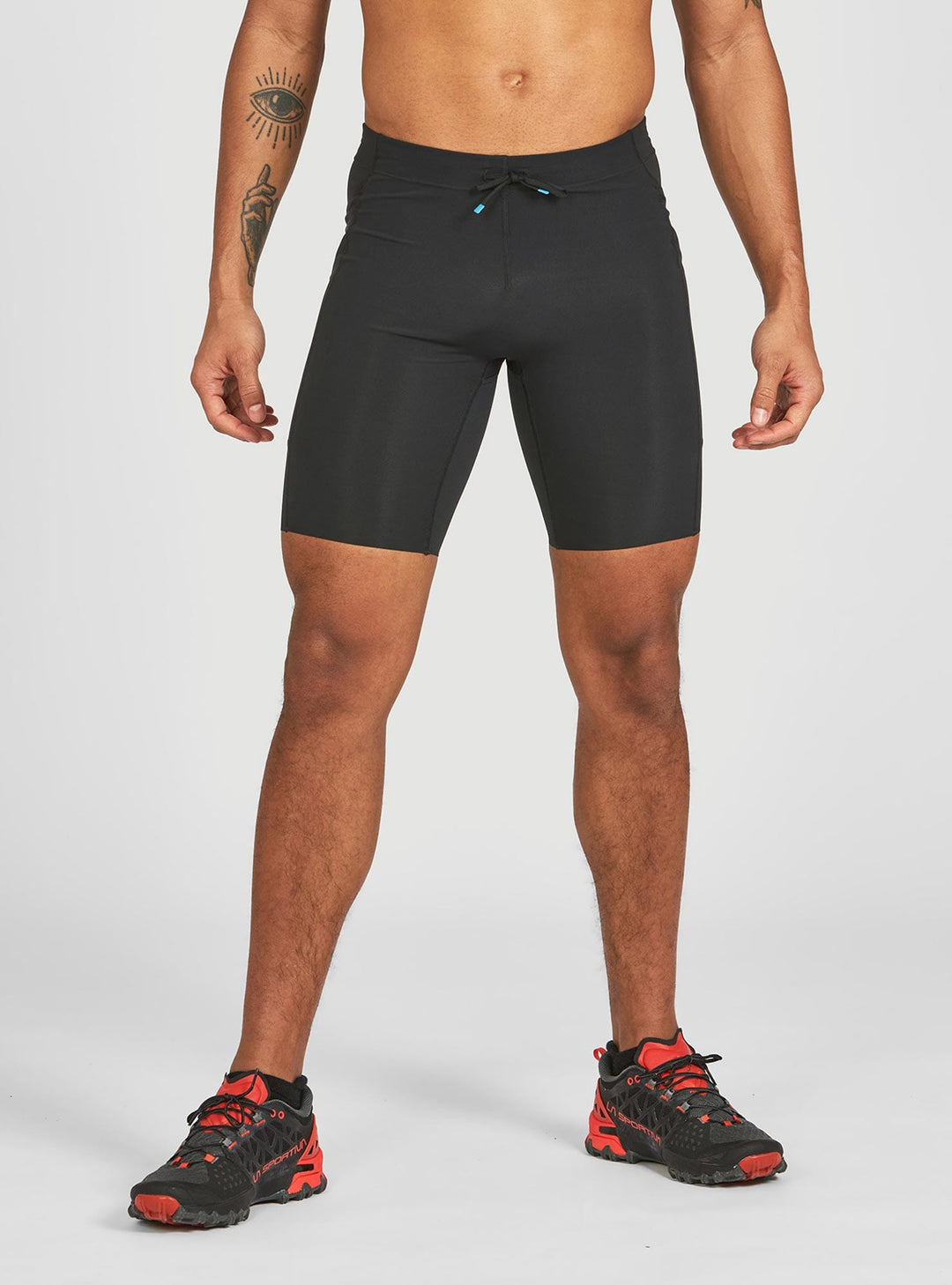 Janji 8 inch trail half tights for men – front view with compressive fit