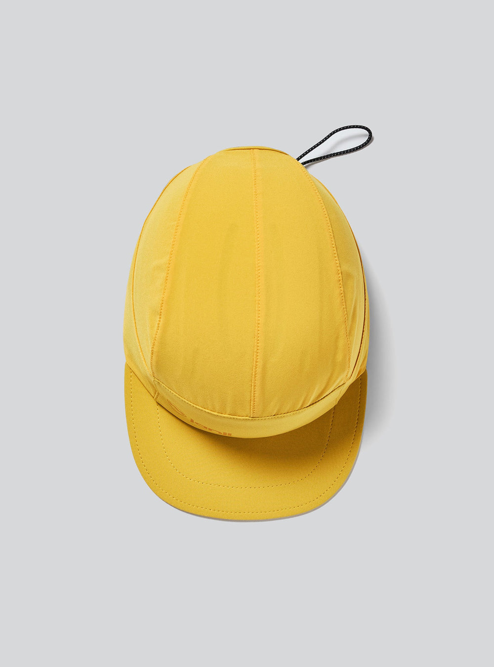 Top view of Janji AFO Hyperlight cap in Goldenray – ultralight running hat
