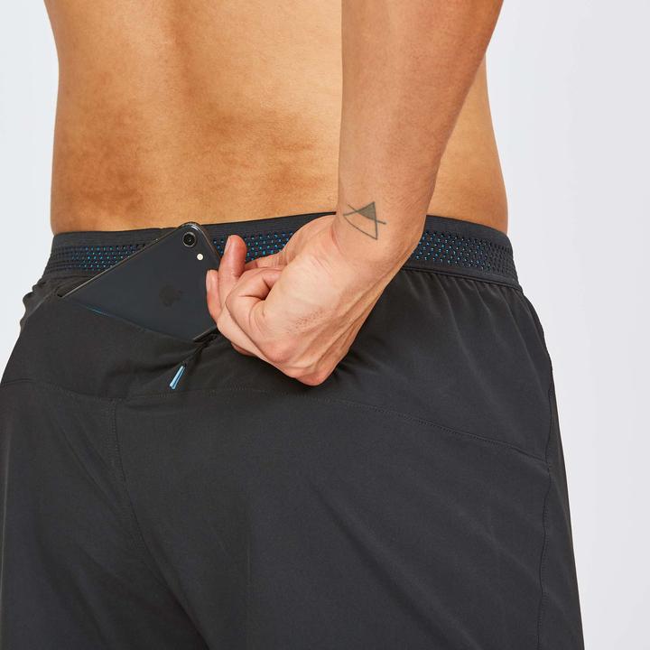Close-up of back zip pocket with phone inside Janji AFO Middle Shorts