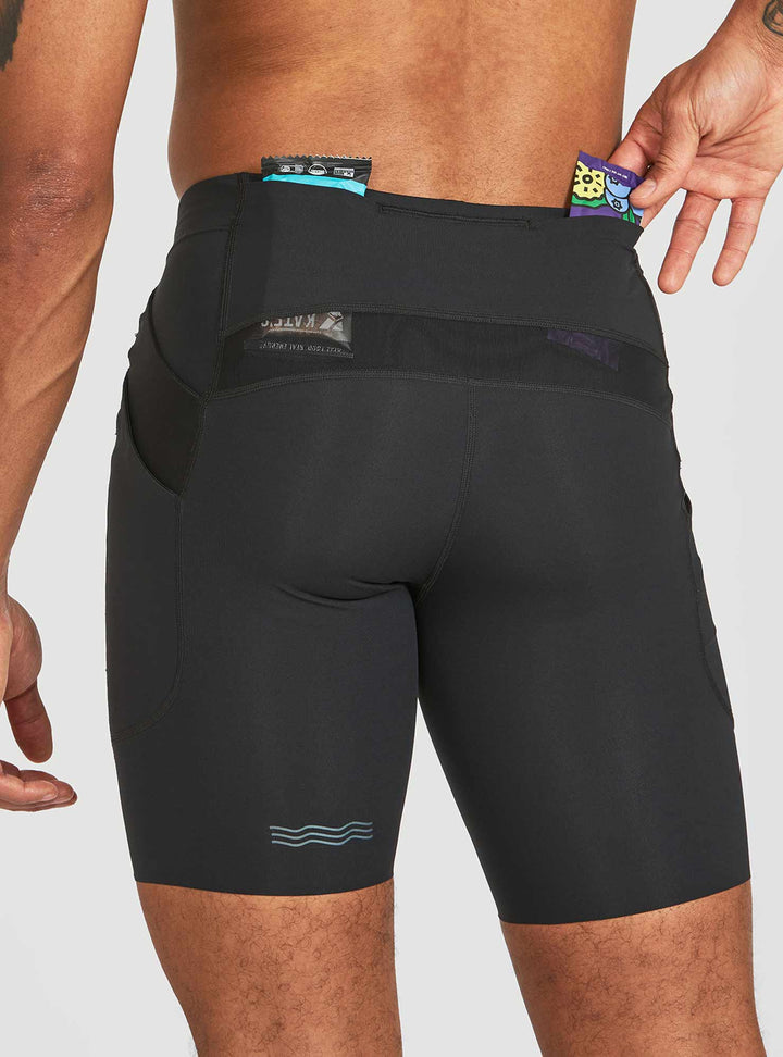 Rear pocket and pass-thru stash compartment on Janji trail half tights