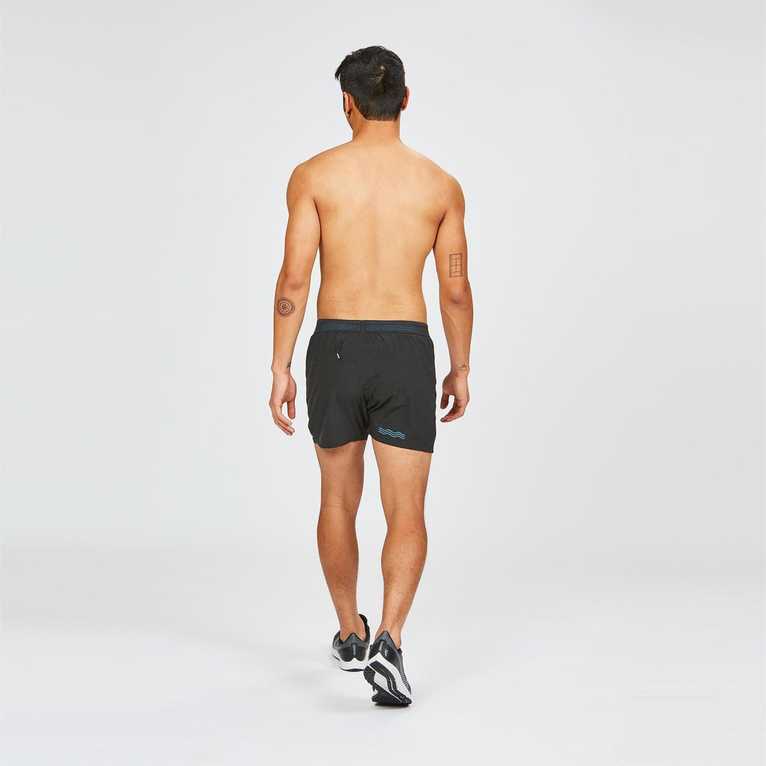 Back view of Janji Men's 5" AFO Middle Shorts showing waistband and reflective details