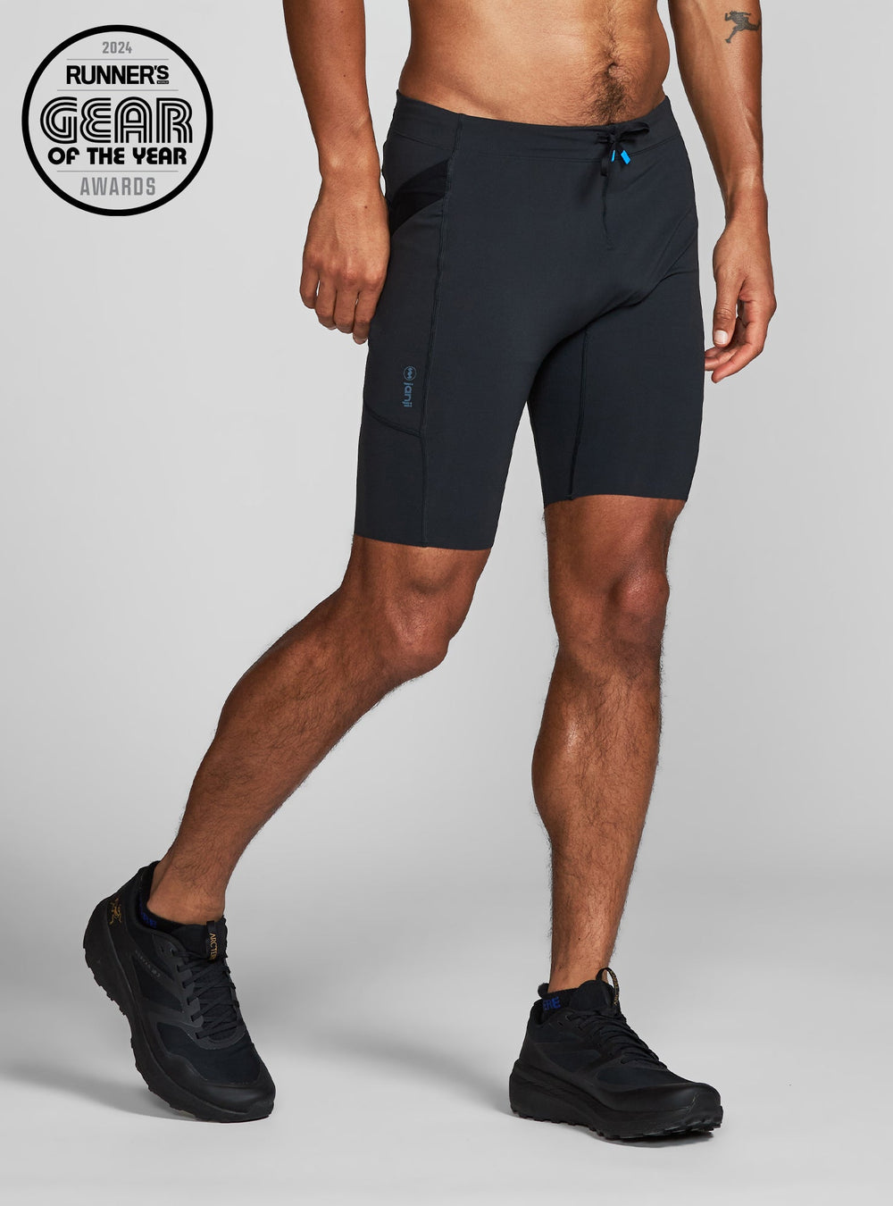 Janji trail half tights for men – close-up with 2024 Runner’s Gear of the Year award stamp