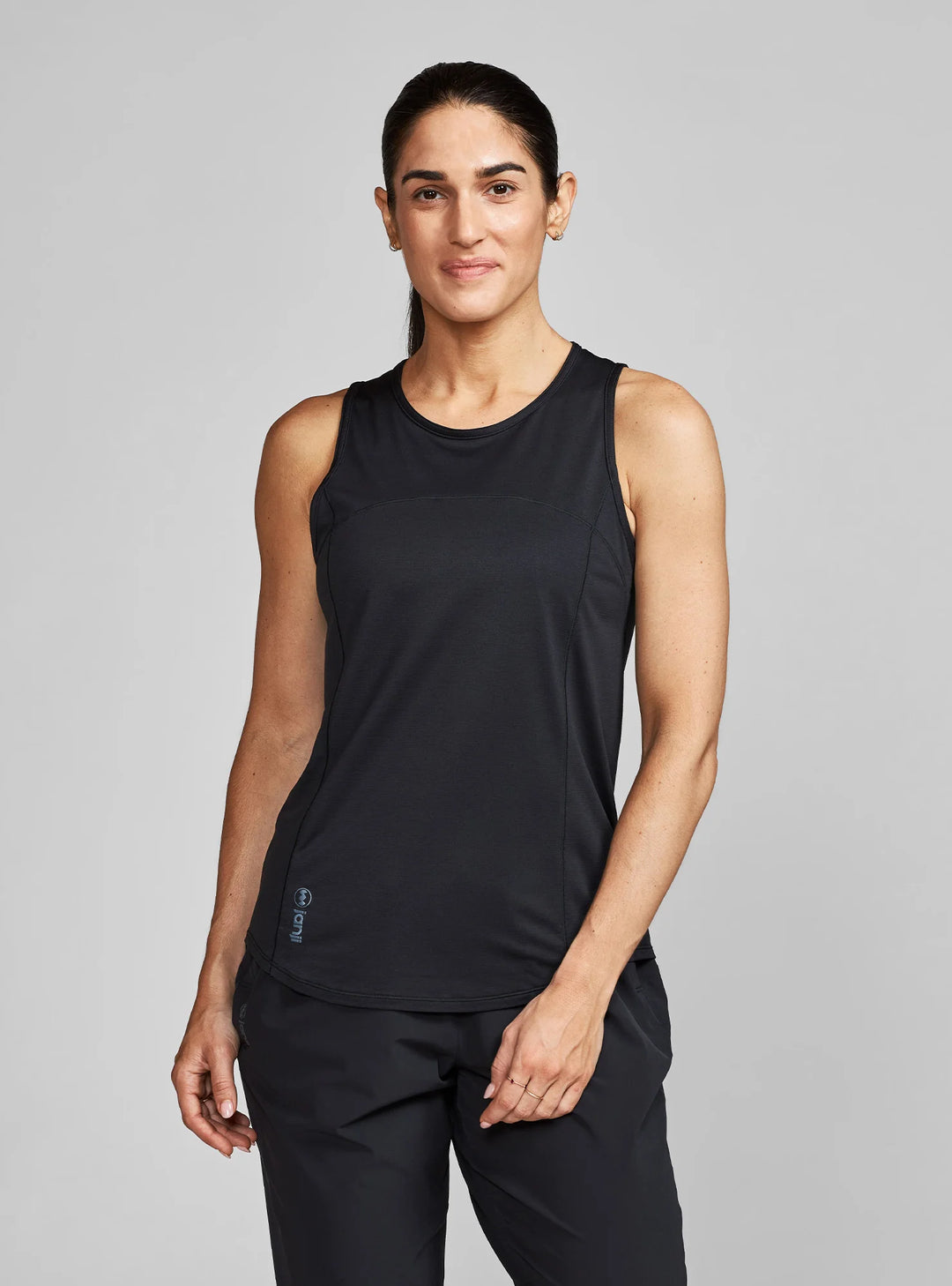 Woman wearing Janji Women’s Quick-Dry Running Tank – front view